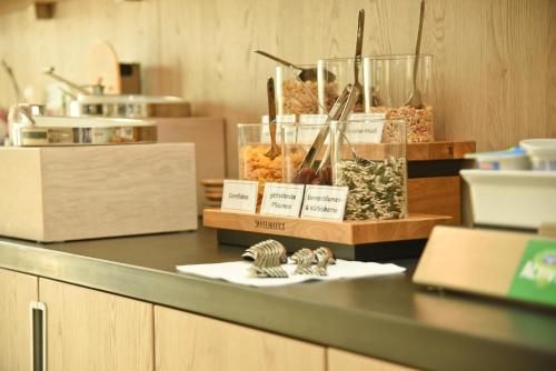 a counter top with some food items on it at Hotel Villa am Rhein in Andernach