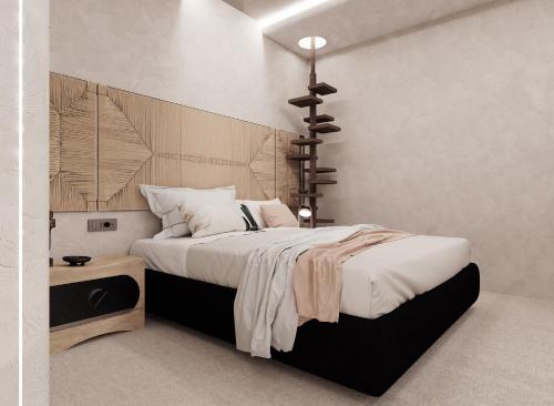a bedroom with a large bed with a wooden headboard at Brilliance of Mykonos in Glastros