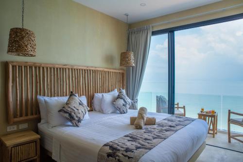 Postel nebo postele na pokoji v ubytování Riviera Beach Hotel