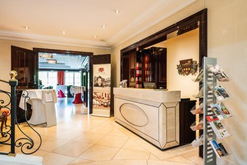 a clothing store with a clothes display in a room at Rheinhotel Schulz in Unkel