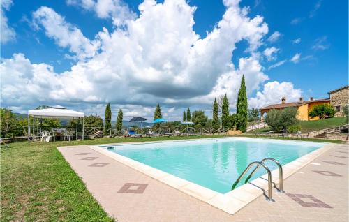 a large swimming pool in a yard with a blue at Fico, Oliva, Mora in Calzolaro