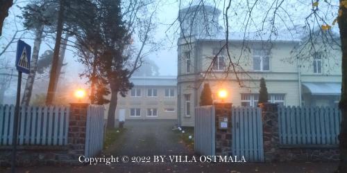 a house on a foggy street with two lights at Villa Ostmala in Ventspils