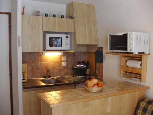 Kuchyňa alebo kuchynka v ubytovaní Appartement de standing au pied des pistes