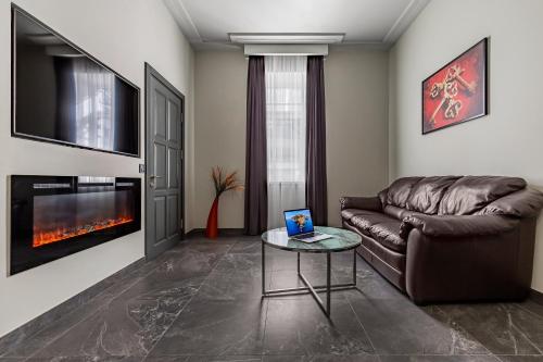 a living room with a couch and a table at Kievinn in Kyiv