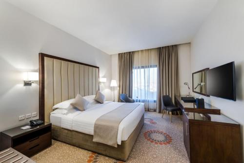 Katil atau katil-katil dalam bilik di Best Western Plus Al Qurayyat City Center
