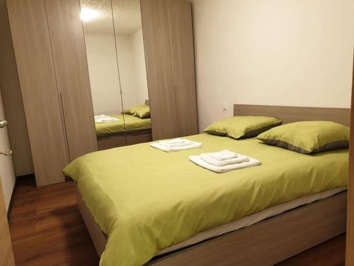 A bed or beds in a room at BnB Rivera-Monteceneri