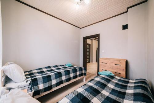 Postel nebo postele na pokoji v ubytování Котедж "Під Горбком"