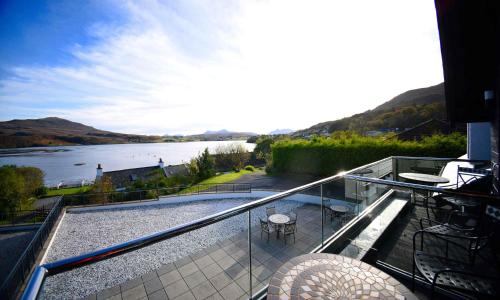 a balcony with a view of a river at Taransay House, Small Hotel in Portree