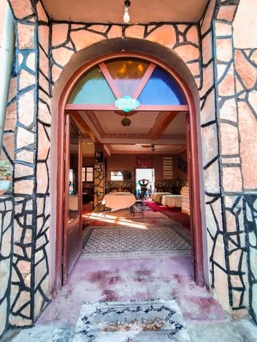 an entry to a house with a glass doorway at auberge restaurant tizgui in Tinerhir