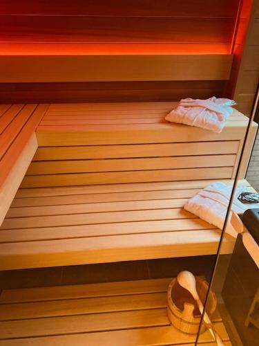 a sauna with two towels and a hat and a basket at ABC Hotel in Blankenberge