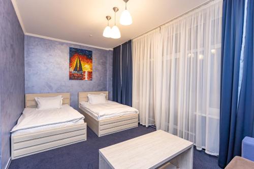 Ένα ή περισσότερα κρεβάτια σε δωμάτιο στο Perlyna Resort