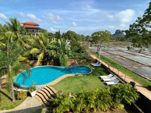 an overhead view of a swimming pool and a resort at Royal Rock Sigiriya in Sigiriya