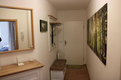 a bathroom with a sink and a mirror at Ferienwohnung Elbtal Meißen, Dresden, Moritzburg in Weinböhla