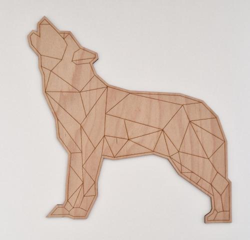 a wooden dog ornament on a white background at Apartmány Minoris in Liptovský Mikuláš