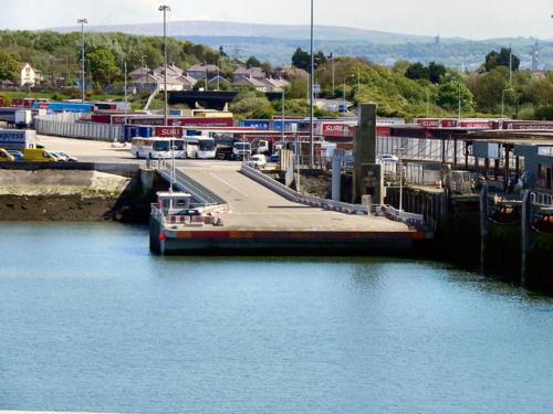 a boat is docked at a dock in the water at Ocean Edge Morecambe Sea view in Heysham