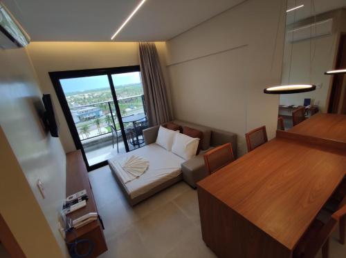 a small living room with a couch and a table at Ap particular 1001 ou 1201 no Salinas Premium Resort in Salinópolis