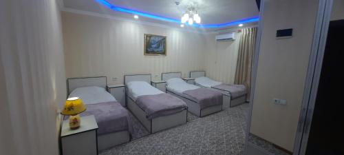 Hotel Zarafshonにあるベッド