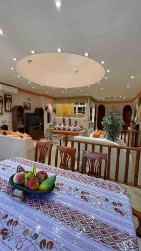 a kitchen with a table with a bowl of fruit on it at Erase una vez o la Catarina in Zihuatanejo