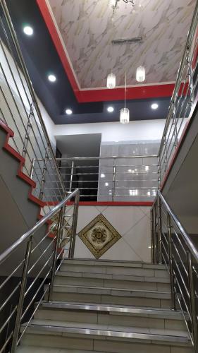 a set of stairs in a building with a ceiling at Abecor Hotel in Welkom