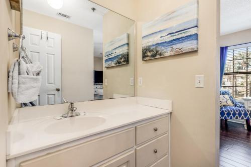 a bathroom with a sink and a mirror at Boatin' n Fishin' in Panama City Beach