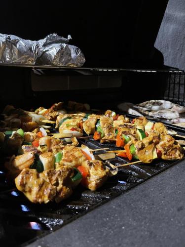 a bunch of food is cooking in an oven at Oasis guesthouse, Boutique Style Hotel in Kralendijk