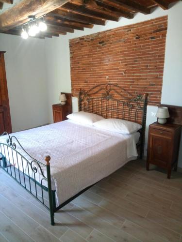 Ένα ή περισσότερα κρεβάτια σε δωμάτιο στο Casa vacanze La Tosca