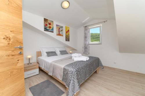Ένα ή περισσότερα κρεβάτια σε δωμάτιο στο Apartments FOREVER