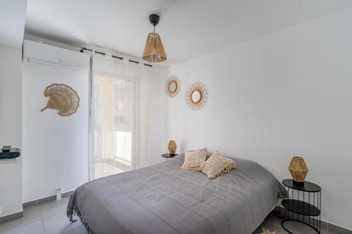 Postel nebo postele na pokoji v ubytování Panier, Major, appartement de 47 m2, parking et terrasse