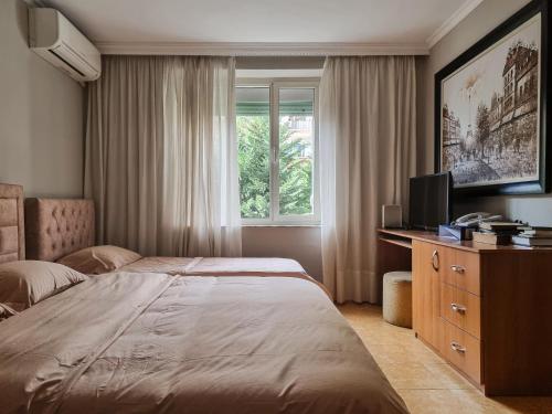Cama o camas de una habitación en Tirana Center Cozy Apartment