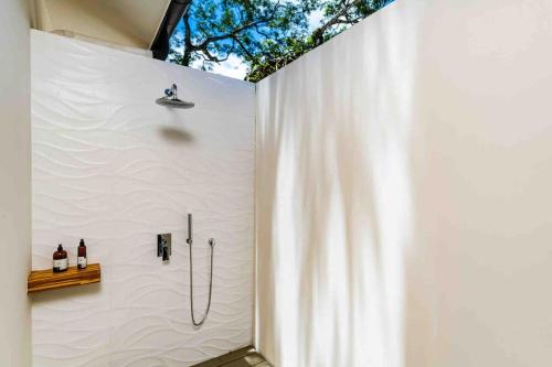a bathroom with a shower with a shower curtain at Villa Twilight Tree 5Bdr Nature & Exclusivity in San José Pinilla