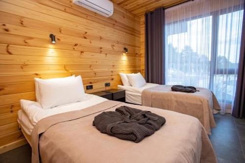 Кровать или кровати в номере Perlyna Resort