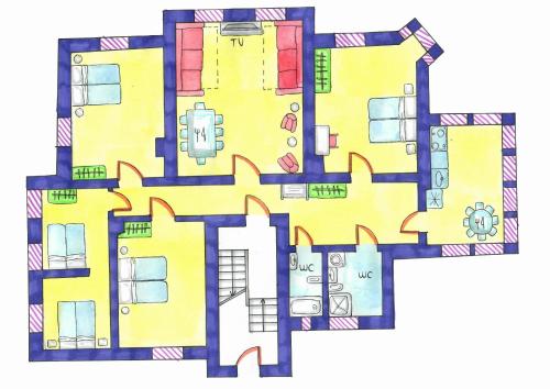 a floor plan of a building with yellow at Dandelion Apartments XIXc Cottage in Rīga