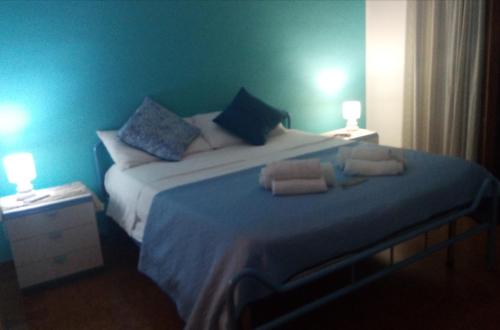 Ein Bett oder Betten in einem Zimmer der Unterkunft Casa Rosamarina