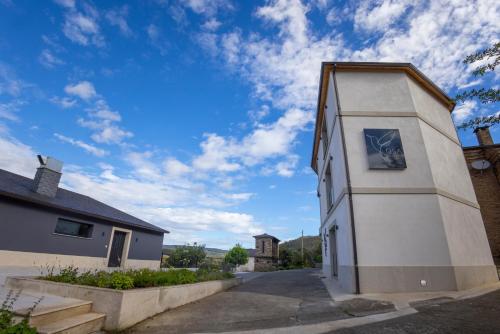 a building with a blue sky in the background at De la Osa Hotel in Abres