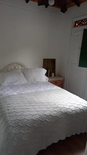 Cama o camas de una habitación en Hostal La Cestería Pueblito Boyacense