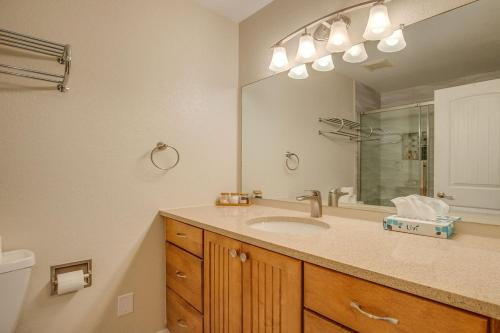 a bathroom with a sink and a large mirror at Townhome Four O'Clock in Breckenridge