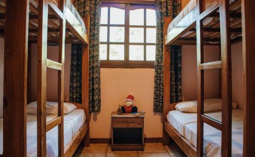 Postel nebo postele na pokoji v ubytování Estrella del Monte