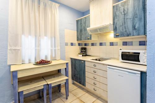 Kuchyň nebo kuchyňský kout v ubytování Apartahotel La Espadaña