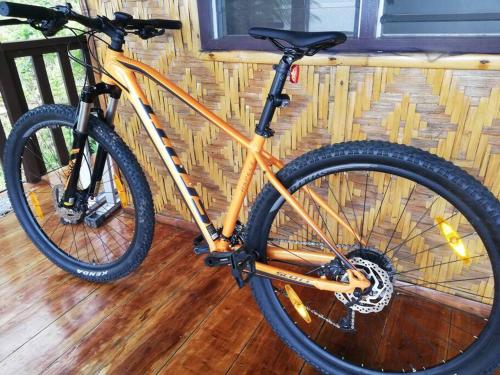 a bike is parked on a wooden floor at The balcony of the camiguin island in Mambajao