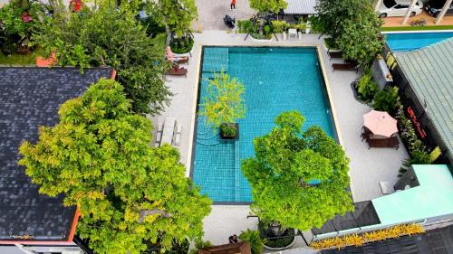 an overhead view of a swimming pool and trees at UR The Private Huahin in Hua Hin