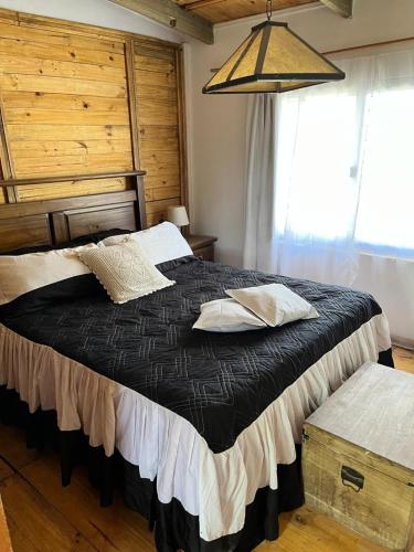 Ένα ή περισσότερα κρεβάτια σε δωμάτιο στο Complejo El Refugio - Las Toscas