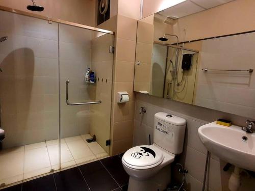 a bathroom with a toilet and a sink and a shower at Executive Premium Comfy Home Mount Austin JB 5Pax in Johor Bahru