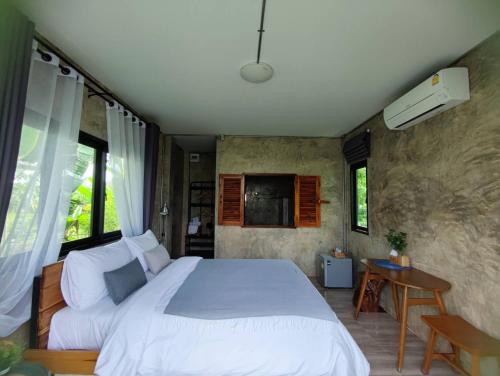 Katil atau katil-katil dalam bilik di Vieng pua homestays