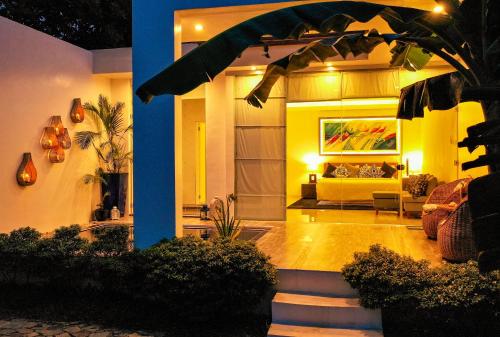 a living room of a house with a couch at The Dream Beach Resort in Taytay