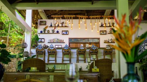 a room with a wall with shelves of vases at The Dream Beach Resort in Taytay