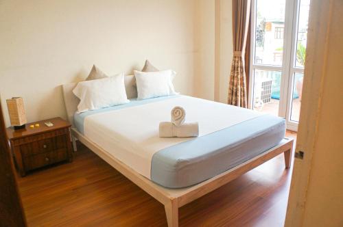 a bedroom with a large bed with a box on it at WECOZY HANOI - Railway Side, The Old Quarter in Hanoi