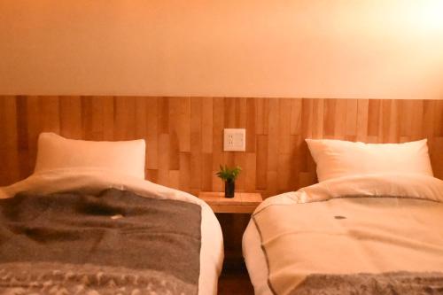 A bed or beds in a room at mizuki natural villa