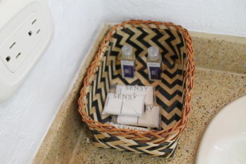a basket on a counter next to a sink at Villa La F in Guasca