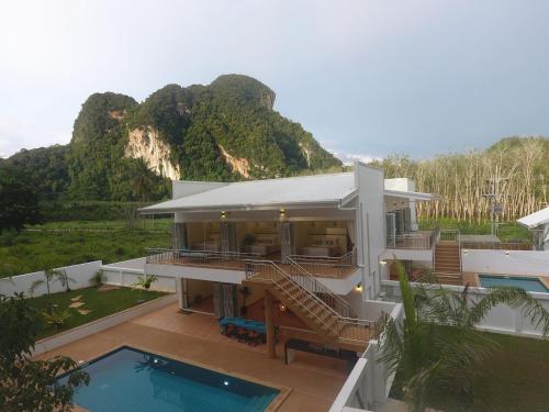 a house with a view of a mountain at 8 Palm Villa - Private Pool Villas in Aonang in Ao Nang Beach