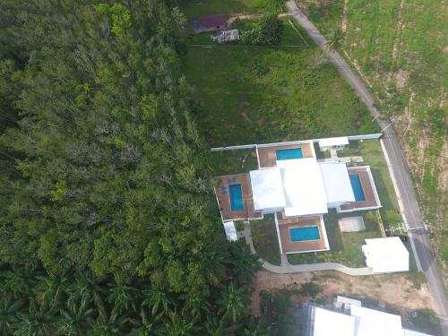 an overhead view of a house in the forest at 8 Palm Villa - Private Pool Villas in Aonang in Ao Nang Beach